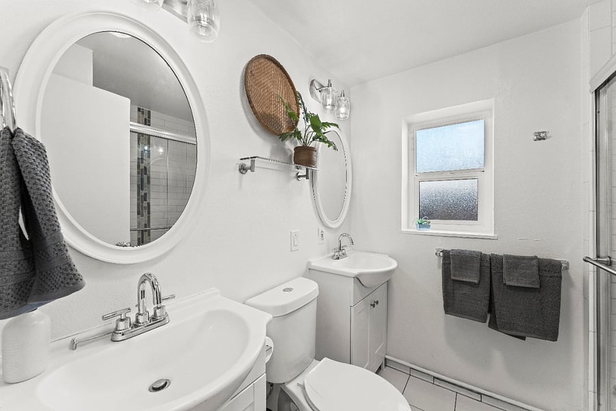 Double sinks and stand alone shower in the bathroom 