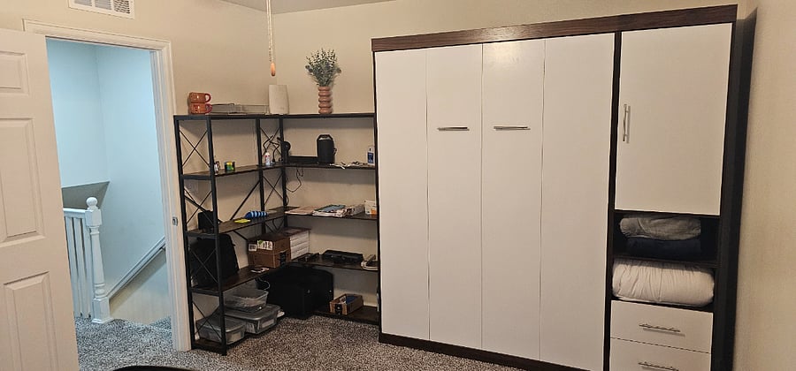 Guest bedroom - shelves with office supplies/printer