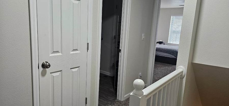 Upstairs - view to bathroom/main bedroom from stairs