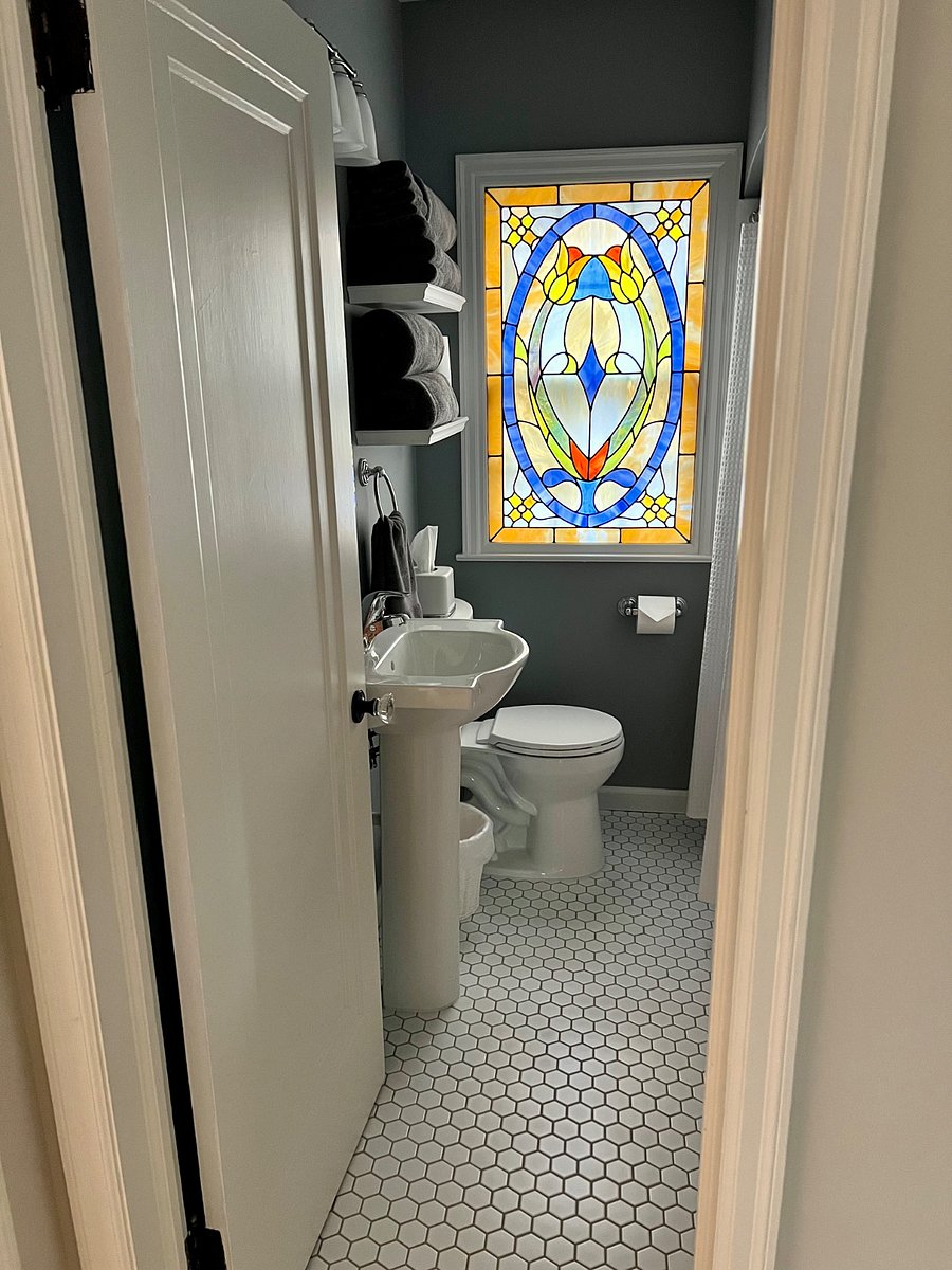 Newly updated bathroom. Medicine cabinet storage as well as 3 hooks on the back of the door and 3 hooks on the wall behind the door.