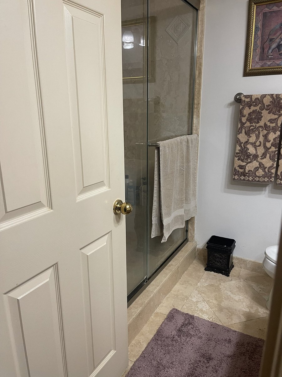 Walk in travertine shower and floor