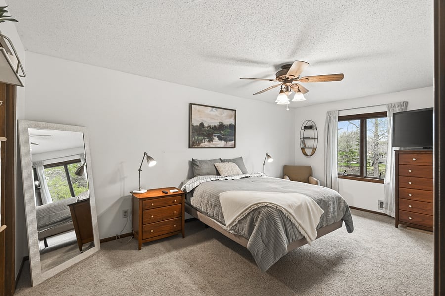 Master bedroom with a large dresser and seating area.
