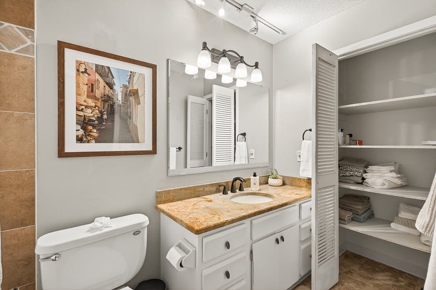 Plenty of storage in the upstairs full bath.