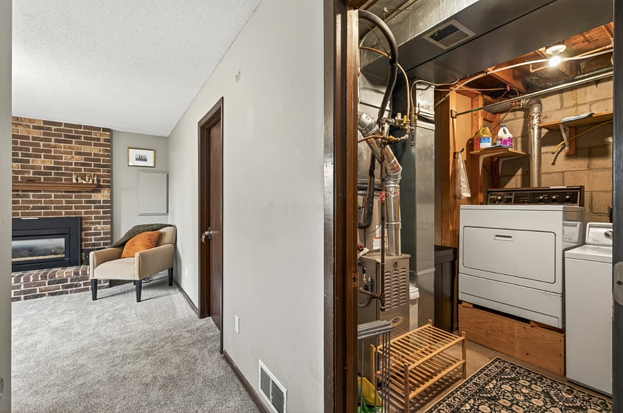 Laundry room/utility room with full sized washer and dryer.