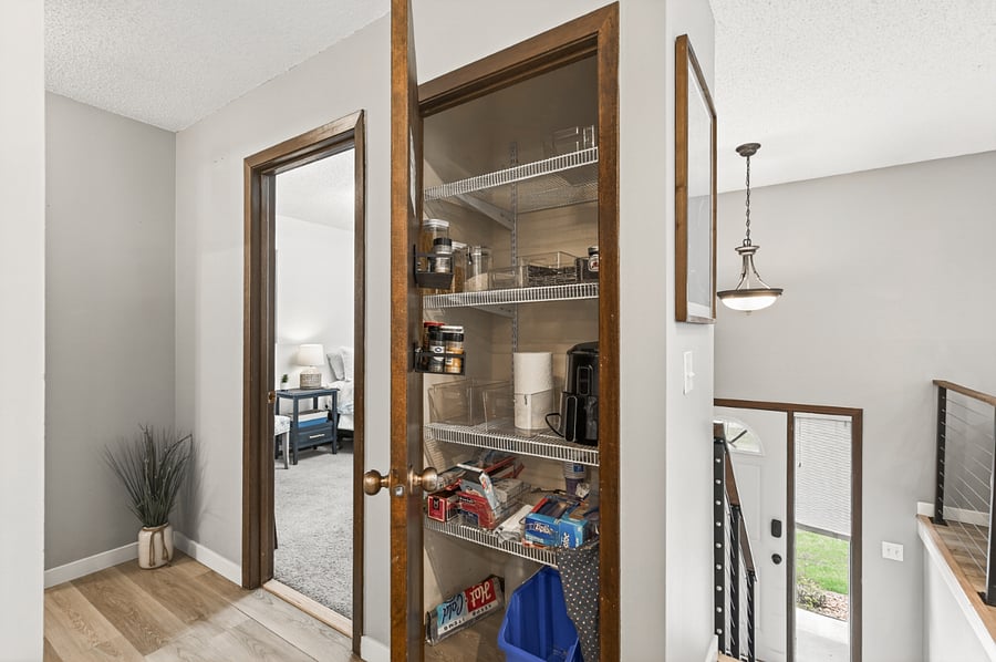 Pantry storage at the top of the staircase.