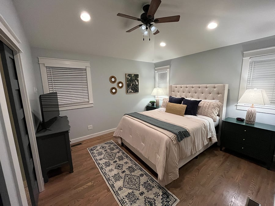 Primary bedroom with vaulted ceilings