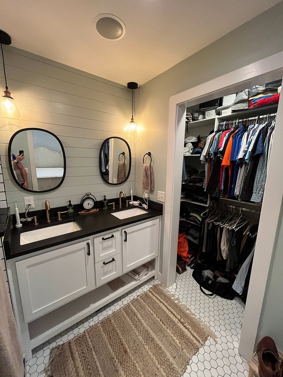 Primary bathroom with double vanity and walk-in closet