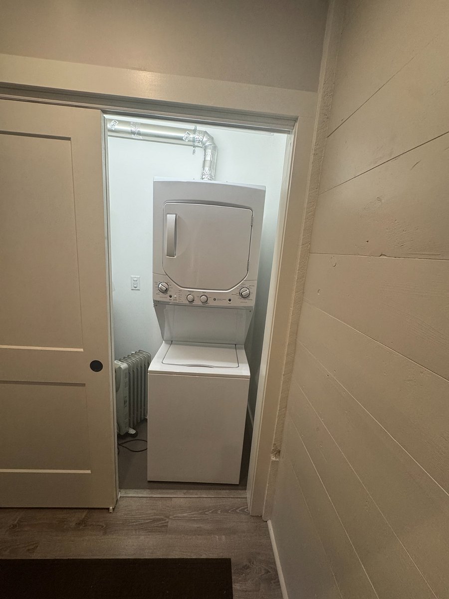 Laundry located at the base of entry way stairs