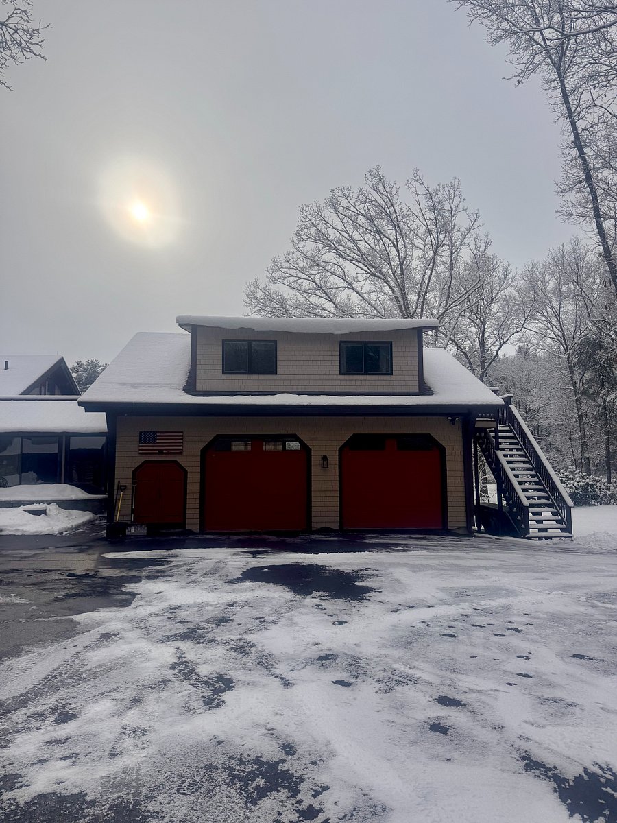 Apartment main entrance to left with emergency exit and small deck to right of apartment
