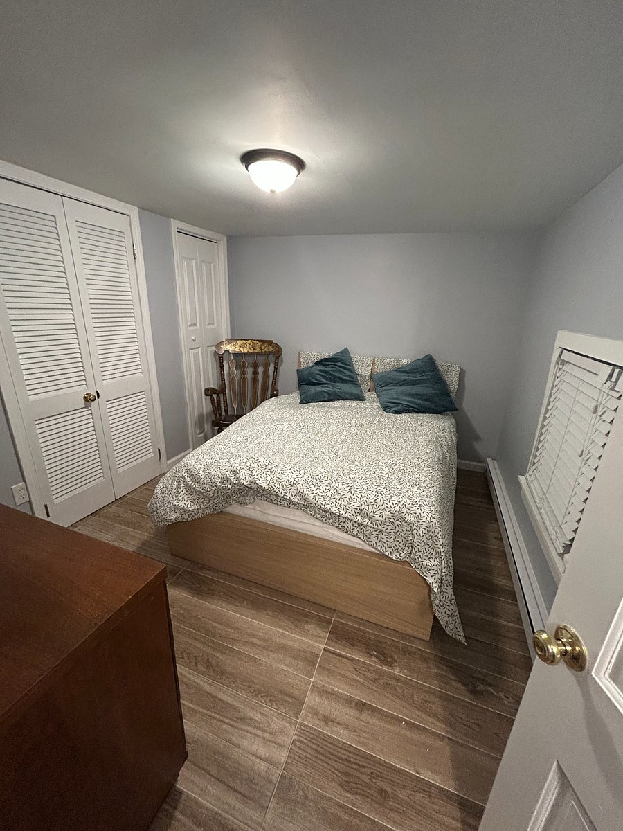 Lower level full bedroom with laundry area in closet