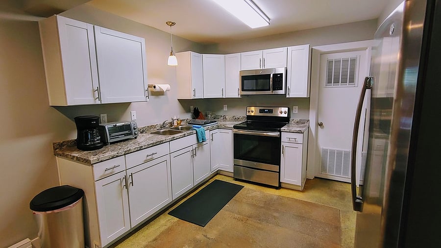 Fully outfitted kitchen with dishware, cookware, utensils.
Countertop has been extended and includes a brand-new dishwasher.