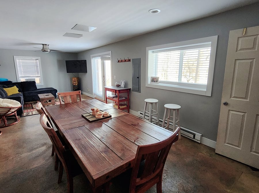 Downstairs dining room. Table seats 6 people. Great work space.