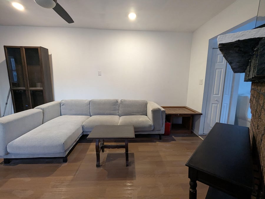 Super comfortable sofa for resting and relaxing with a 65" Smart TV, books and games for entertaining.