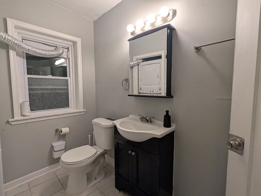The shared bathroom includes storage, laundry and shower storage.