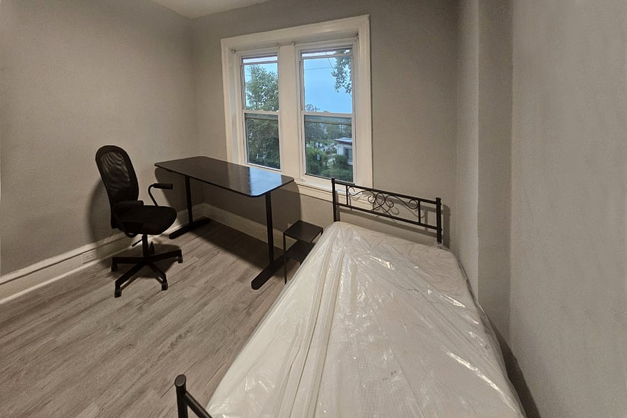 'Prussia' bedroom offers an AMAZING view of the sunset and sunrise, a large workstation, closet and a dresser.