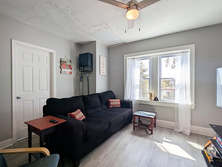 Cozy Living Room with comfortable couch, & lounge chair,.