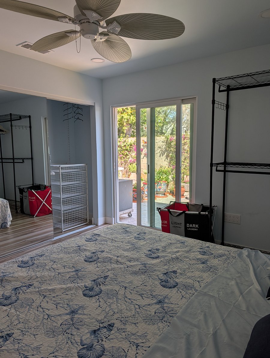Master bedroom closet, patio in the background