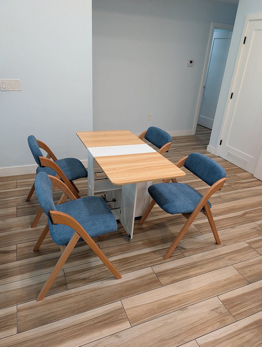 Living room, small expandable dining table can seat 4 and even 6 people. But generally everyone uses the Island and it's 4 barstools