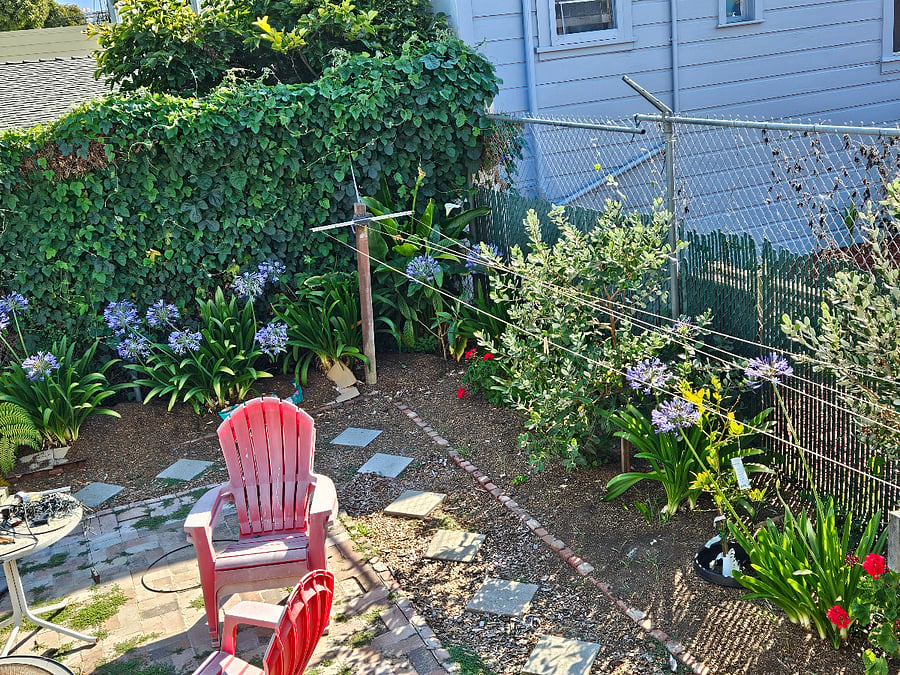 View out the French doors to Back corner of patio for guest use.