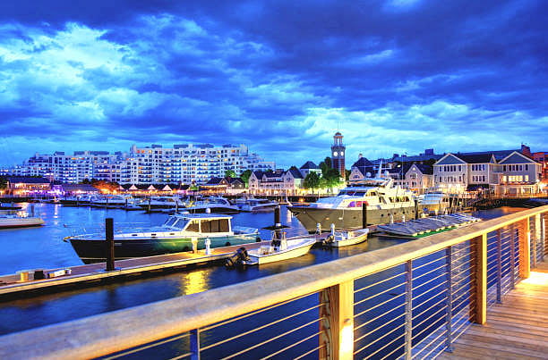 The Marina Bay waterfront boardwalk offers a vast array of dining options, boutique shopping, craft brew pubs, & dog-friendly walking trails. The area is known for its vibrant atmoshphere and recreational boating. A ferry service runs into Boston.
