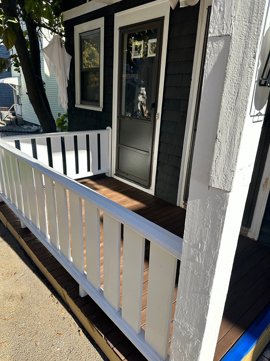Private rear entrance from back deck with driveway parking for one car.