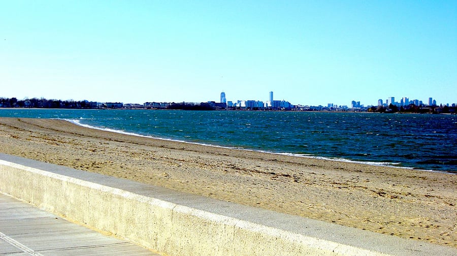 Wollaston Beach is only 2 miles away and a favorite spot for swimmers, boaters and sunbathers. Marina Bay and Boston skyline in the distance.
