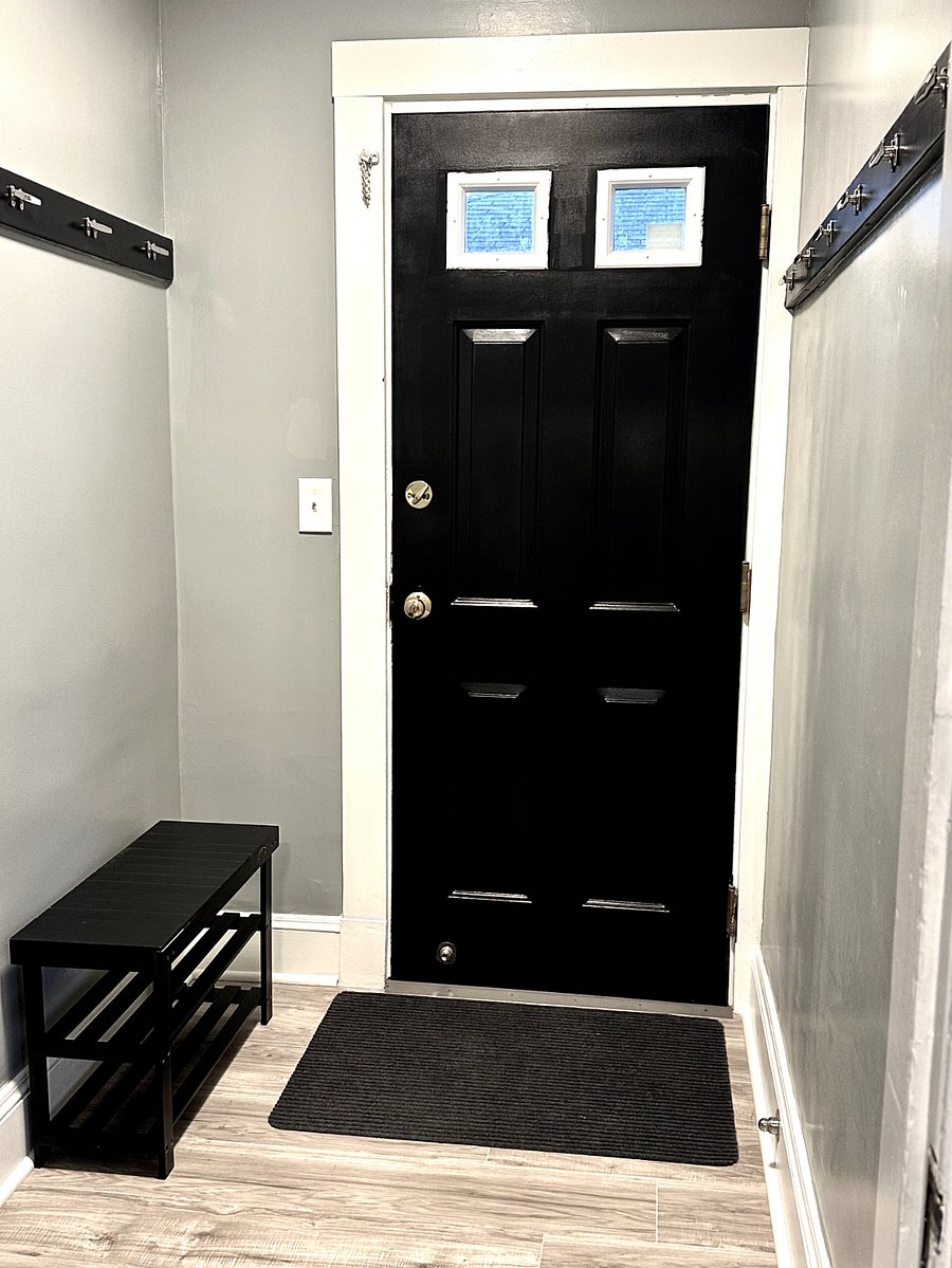 Private back entrance into enclosed mudroom adds everyday functionality.