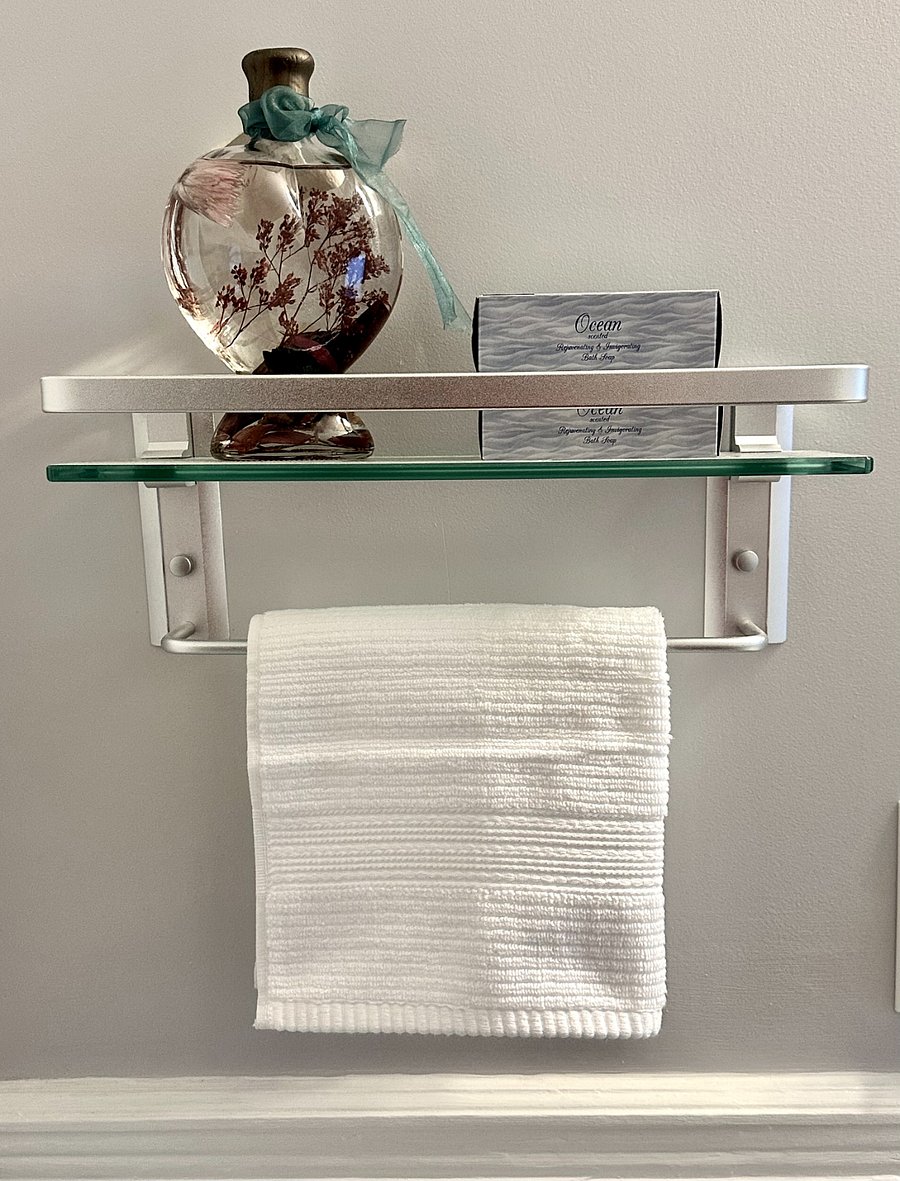 Start your day refreshed in this sparkling clean bathroom fully stocked with bath essentials and toiletry needs.