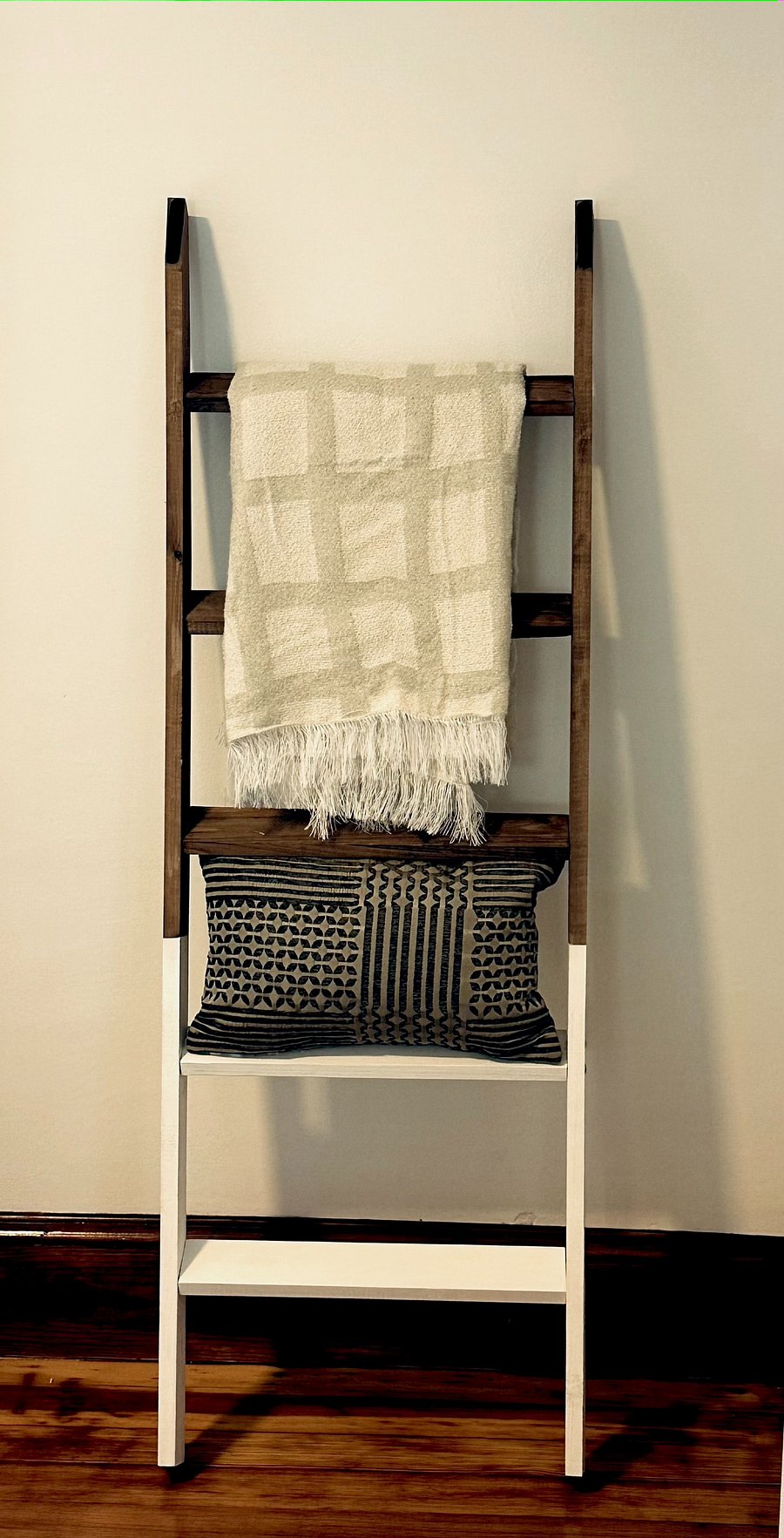 Blanket ladders in bedroom to keep extra blankets and pillows neatly organized and convenient