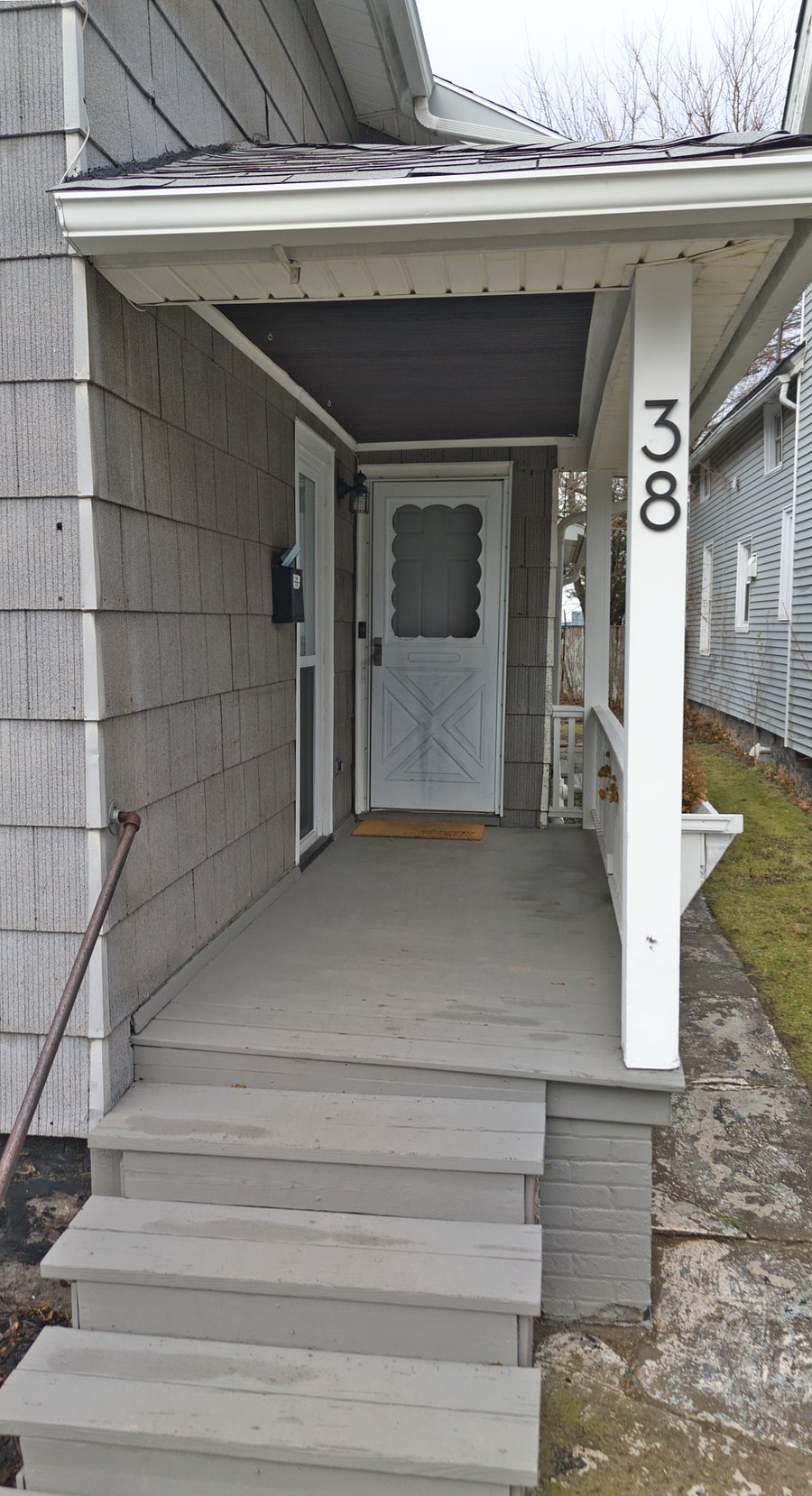 The exterior entryway features stairs leading to the porch and front door, equipped with motion alert lighting and HD video for added safety.