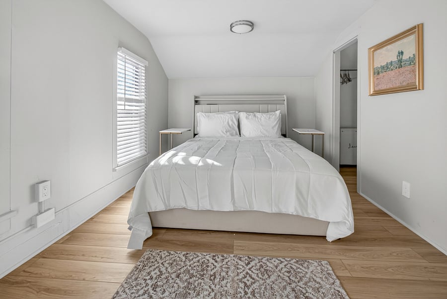 Bedroom 3 is the primary (master) bedroom and features a queen bed with an LED light frame, underbed storage and, two side tables.