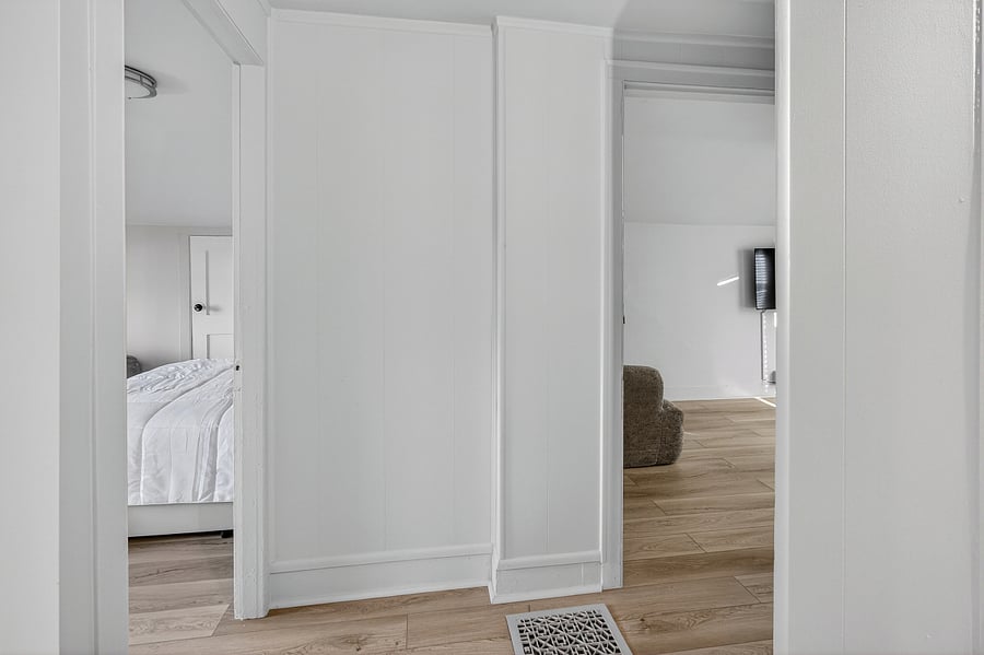 The entry is shared between upstairs Bedrooms 2 and 3, providing convenient access to both rooms.