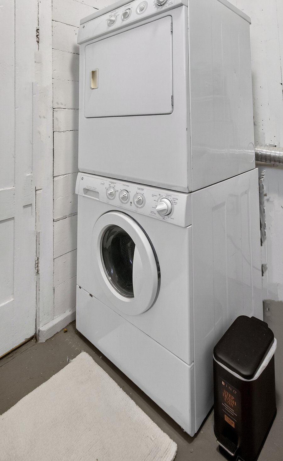 A stacked washer and dryer are included for convenient in-home laundry.