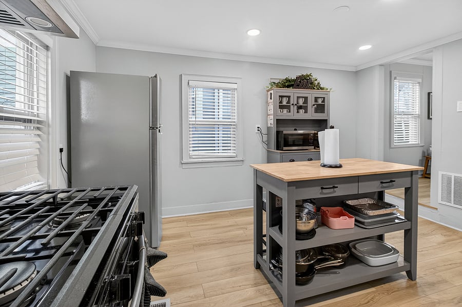 The chefs table is fully equipped with pots, pans, and bakeware, making it ideal for preparing a wide variety of meals.