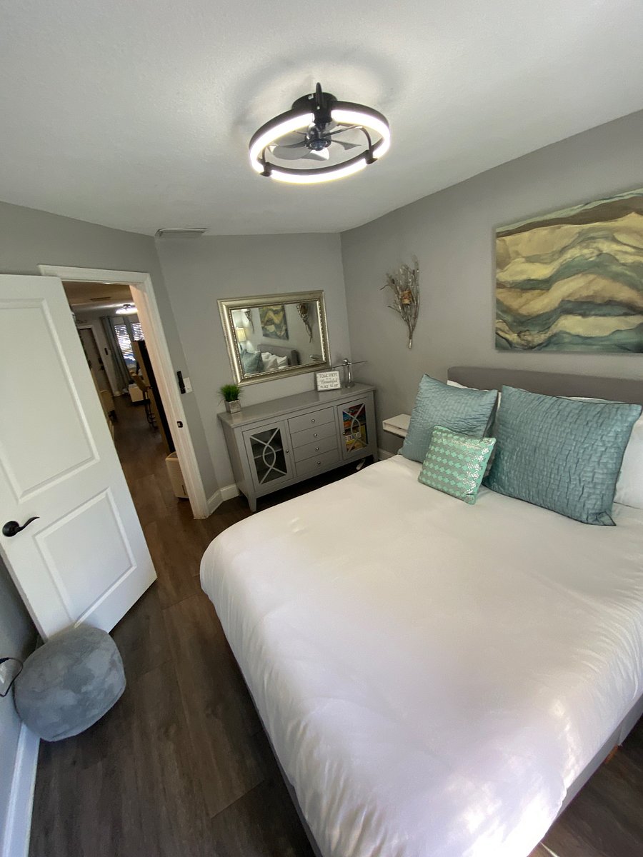 Bedroom 1 has a queen bed, dresser, desk, closet & flat screen tv