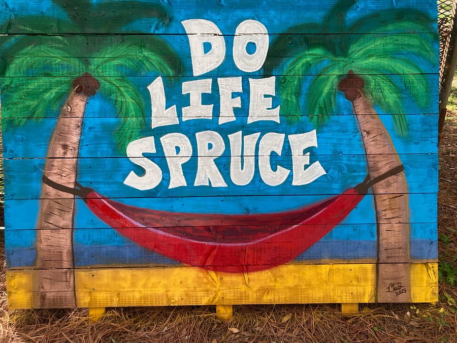 Do life spruce mural located in rear of garage studio right next to parking