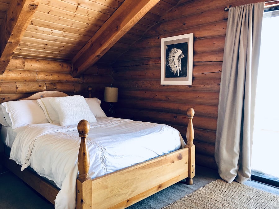 Guest bedroom with balcony. back side upstairs.