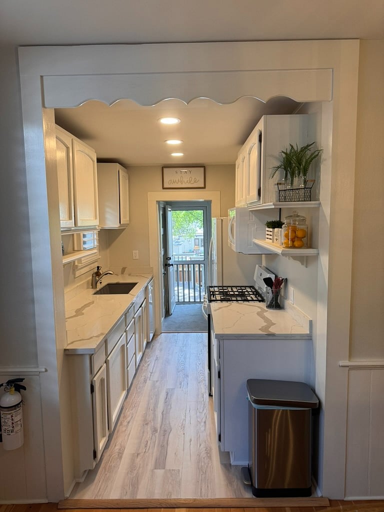 Entrance to kitchen, looking out to rear deck