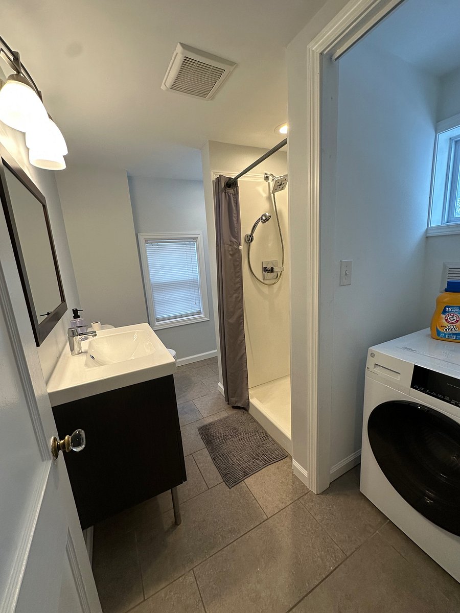 Renovated bathroom with laundry