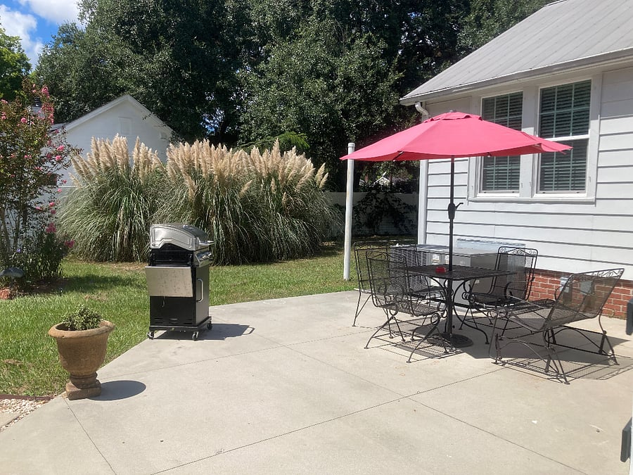Fenced backyard with gas grill