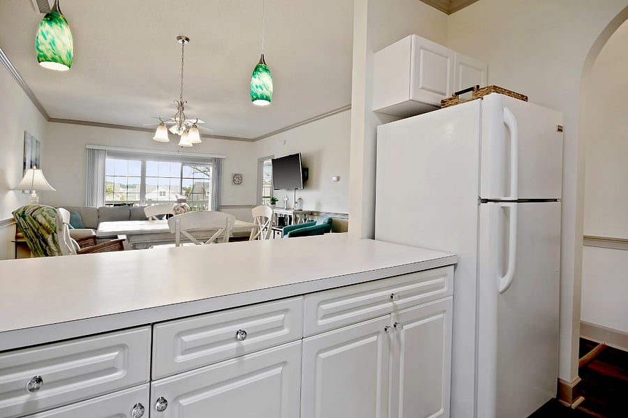 The condo has a fridge with ice maker, stove/oven, microwave, and dishwasher.