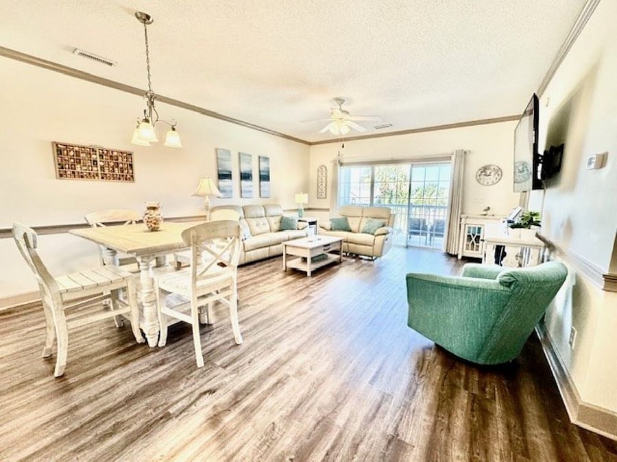 The open living room and dining room offers ample space to relax and recharge.