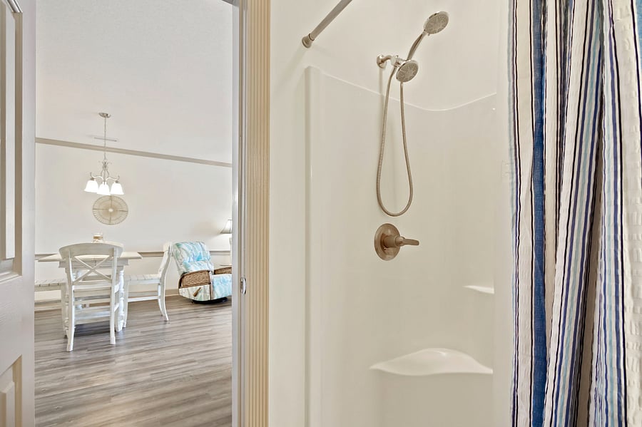 The second bathroom features a large walk-in shower.