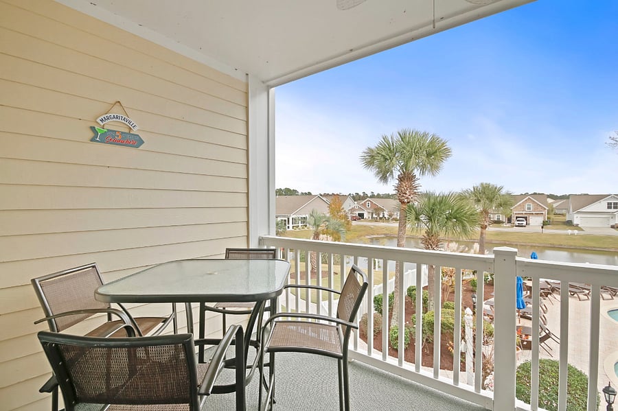There is a high-top table on the patio with seating for four.
