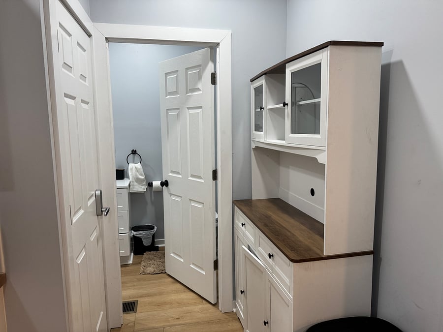 Kitchen leading to downstairs bathroom