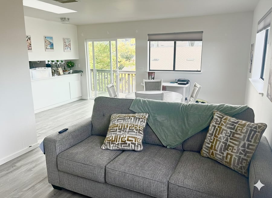 Living room, workspace, and dining area