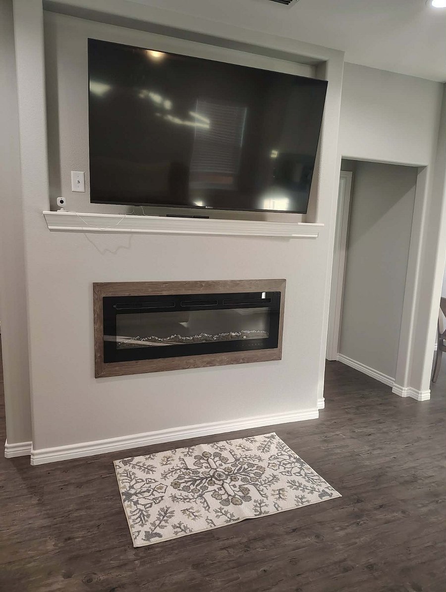 Romantic electric fireplace in living area and main bedroom.