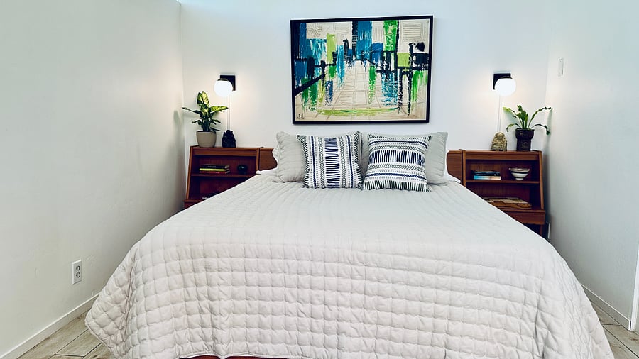 Thoughtfully selected furnishings create a warm mid-century atmosphere.
