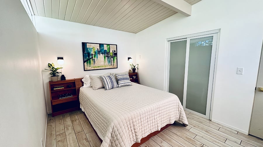 Translucent closet doors provide generous storage while maintaining a clean, modern aesthetic.