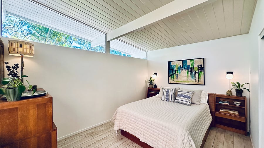 The inviting guest suite features soaring vaulted ceilings and clerestory windows.